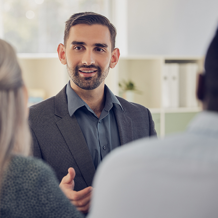 Mortgage Broker discussing mortgage options with clients | Honor Home Loans