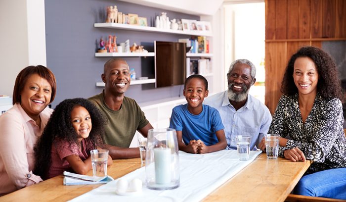 portrait-of-multi-generation-family-sitting-around-table | Honor Home Loans